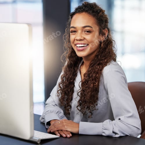 Preview: So proud of my business acumen. Shot of a young businesswoman working on her computer at work.