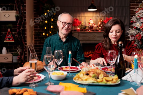 Preview: Senior man at dinner with family