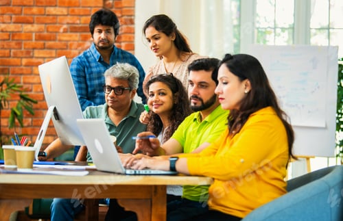 Preview: Young Indian entrepreneurs collaborating on an important project, deeply engaged in office work