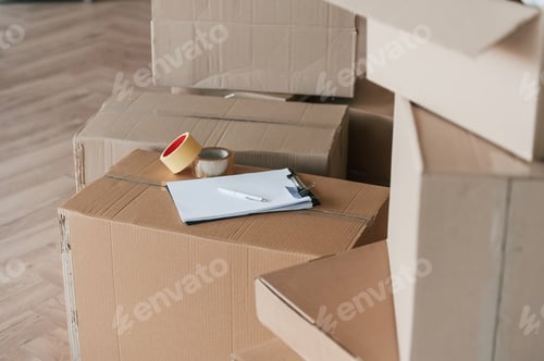 Preview: Boxes with scotch tape and notepad. Conception of moving to new house