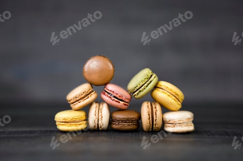 Preview: Colorful macaron cookies on the dark background