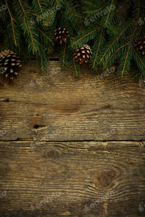 Preview: Christmas tree branches on wooden texture