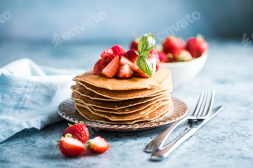 Preview: A stack of pancakes with maple syrup