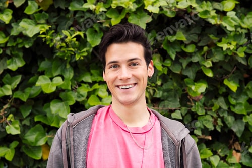 Preview: portrait of a happy young man looking at camera