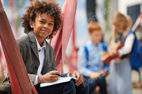 Preview: African boy doing homework