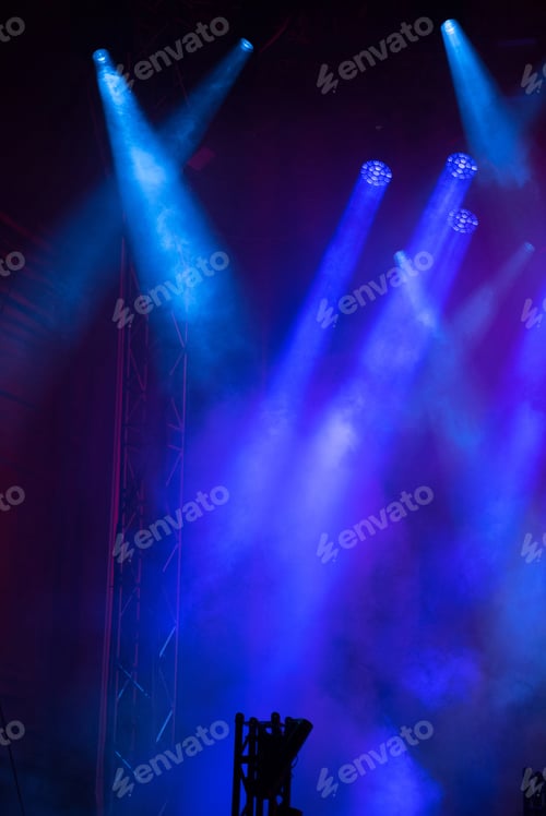 Preview: Blue stage lights at music festival