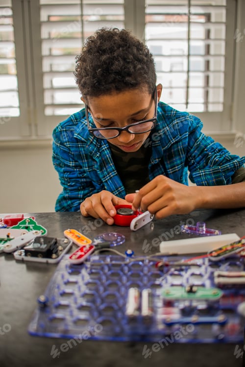 Preview: Boy working on science project at home