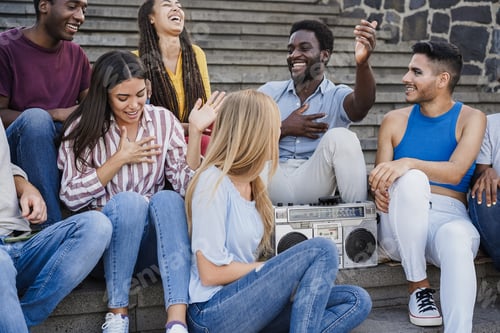 Preview: Young diverse people dancing and listening music with boombox stereo outdoor in the city