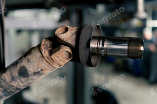 Preview: close-up of a car detail in a suspended state at a service station an iron tube from the chassis