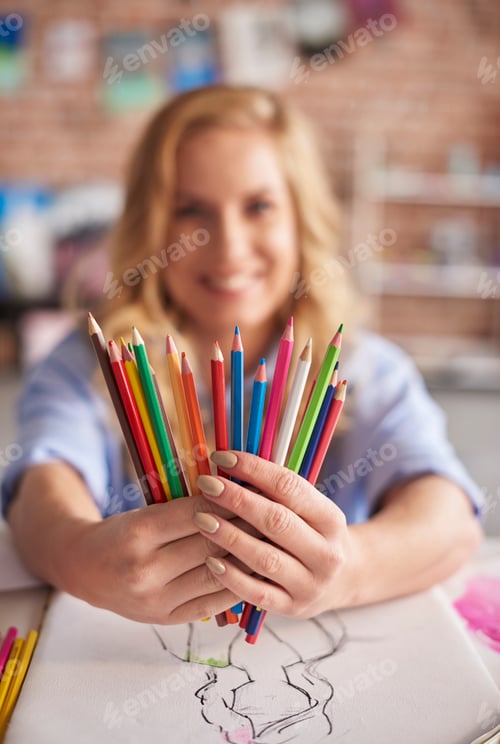 Preview: Woman showing her colorful equipment