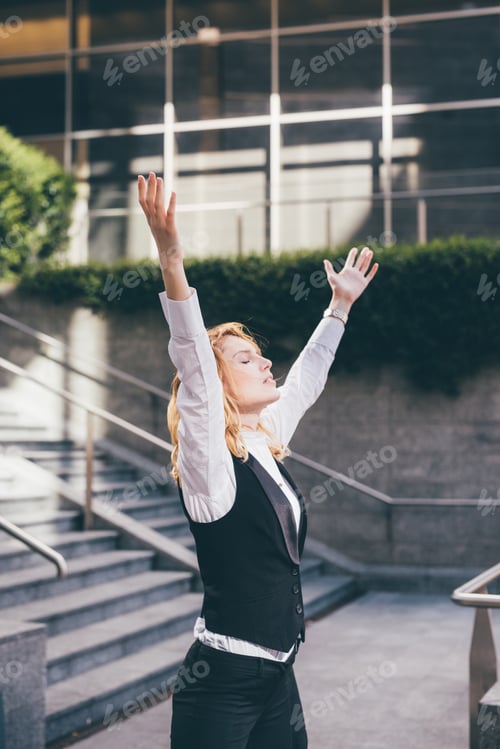 Preview: young contemporary businesswoman feeling free