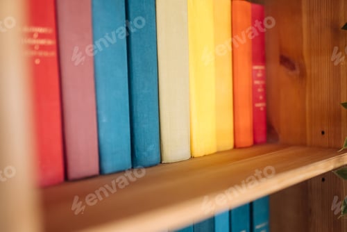 Preview: Many books on wooden shelf, close view