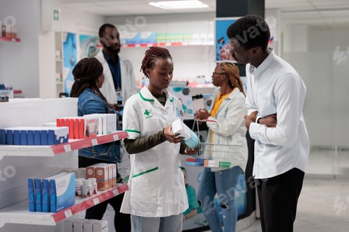 Preview: Pharmacy consultant recommending buyer stomachache medication