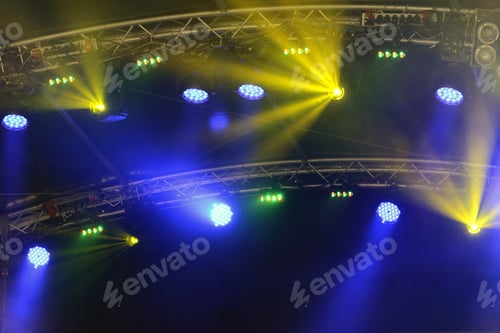 Preview: stage lights on a concert open air during night time. colorful.