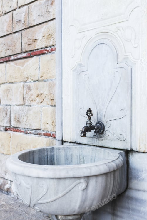 Preview: Old street washbasin with a few taps. With beautiful marble texture. Turkish tradition
