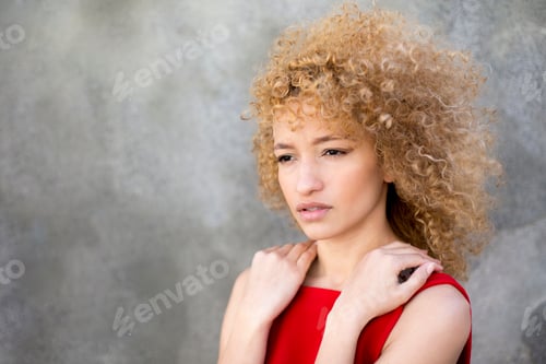 Preview: portrait latin young serious curly hair woman