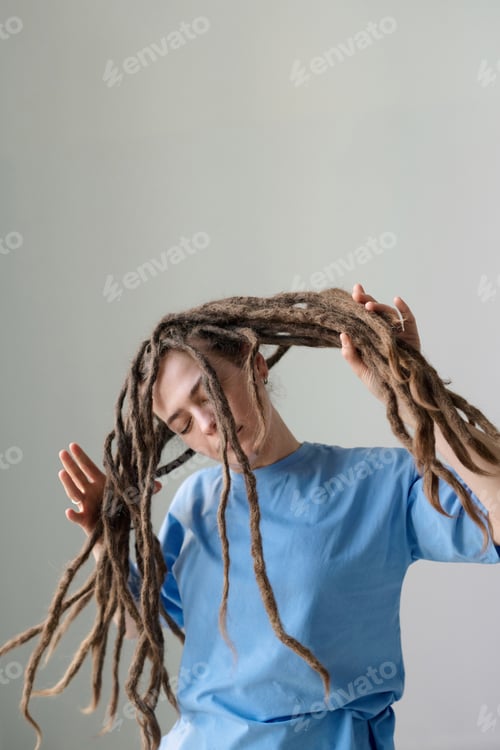 Preview: Woman with Long Dreadlocks Dancing on White