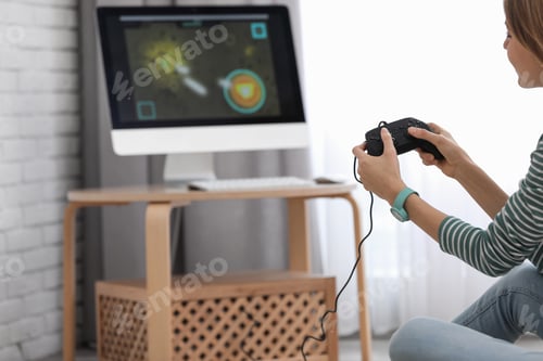 Preview: Young woman playing video game at home