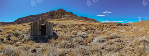 Preview: Solitary outhouse in desert landscape by mountains, Candelaria, Nevada ghost town