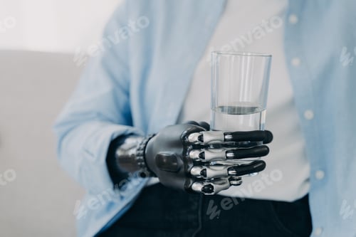 Preview: Morning routines of disabled person. Girl is holding glass of water with robotic arm prosthesis.