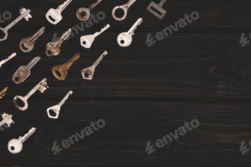 Preview: top view of different vintage keys on black table