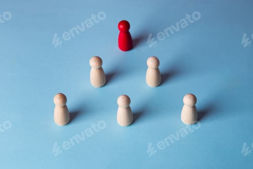 Preview: Red wooden figure leading team pyramid on blue background
