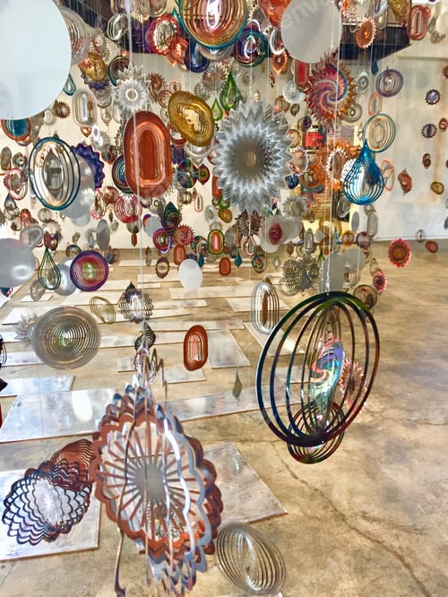 Preview: Colorful, twirling, metallic art installation at a museum of contemporary art.