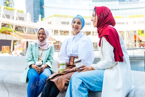 Preview: Beautiful muslim girl wearing hijab bonding outdoors