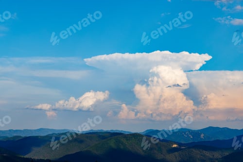 Preview: Clouds stretch across the blue sky above the valley of the Rhodope Mountains