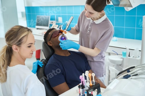 Preview: Woman doctor treating patient in the dentistry