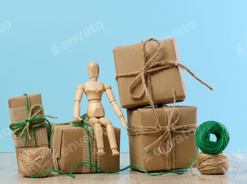 Preview: The box is packed in brown craft paper and tied with a rope on a blue background, gift