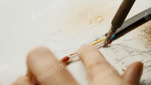 Preview: Soldering iron, wiring repair. Creative. Close up of industrial background of worker in protective