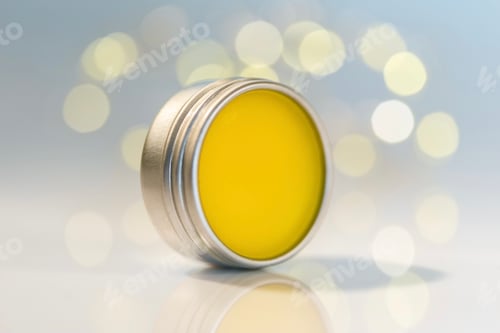 Preview: Open metal container with natural lip balm. Homemade beauty care products. Eco friendly package
