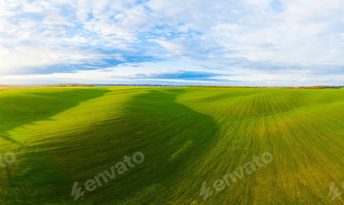 Preview: Flying over an green empty field
