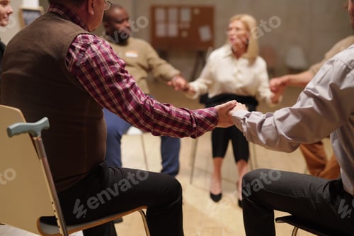 Preview: Patients of psychologist holding by hands during discussion of problems