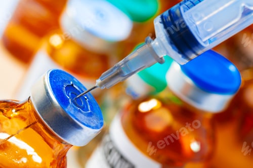 Preview: Medical vial with medication and syringe close up