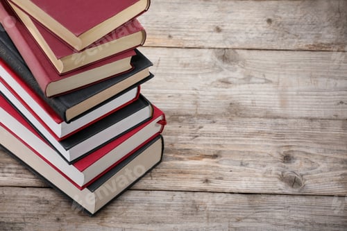 Preview: Stack of old books on wooden table, closeup. Space for text