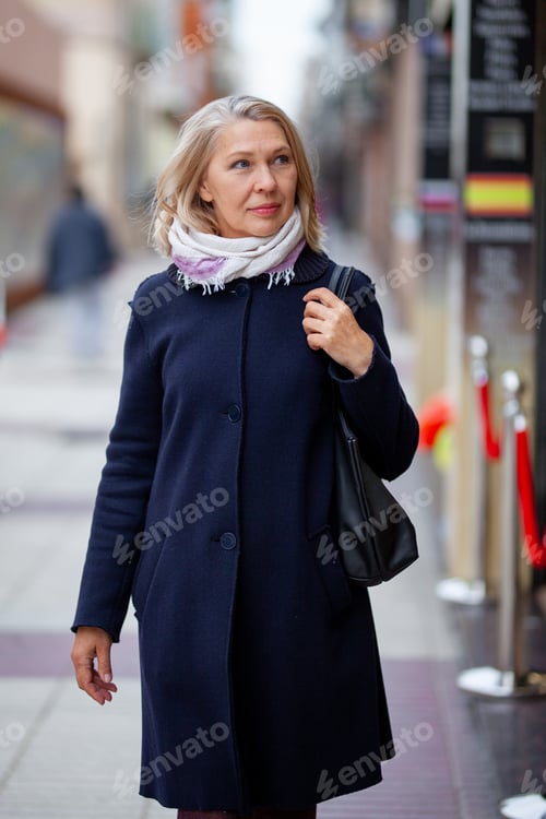Preview: Happy Pensioner Woman Walks On Streets Of A Tourist City.