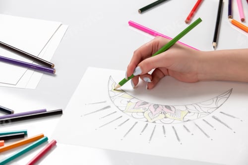 Preview: Drawing a young girl hand drawing a moon with green pencil