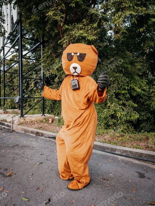 Preview: Man wearing bear costume is dancing at the Wang Kelian lookout point.