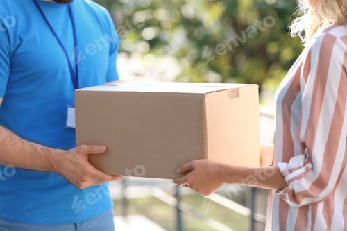 Preview: Woman receiving parcel from deliveryman on blurred background, closeup. Space for text