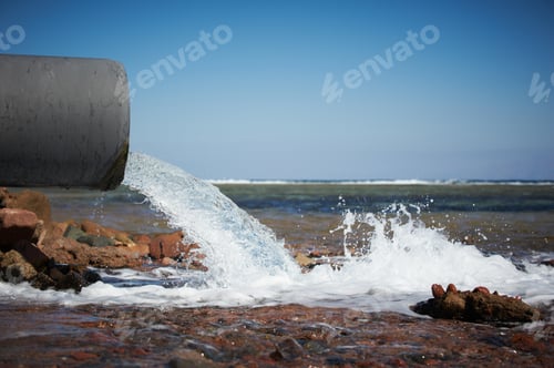 Preview: clear water flows from a pipe into the sea