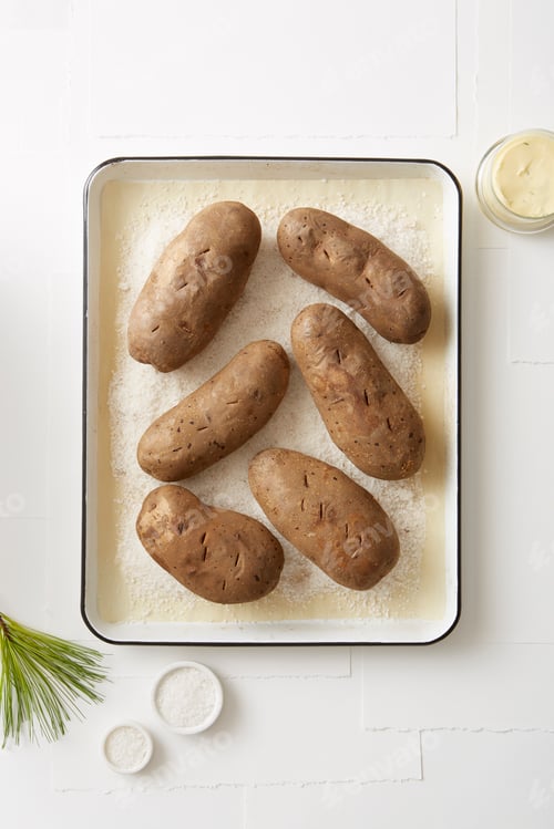 Preview: Still life of salt baked potatoes in roasting tin