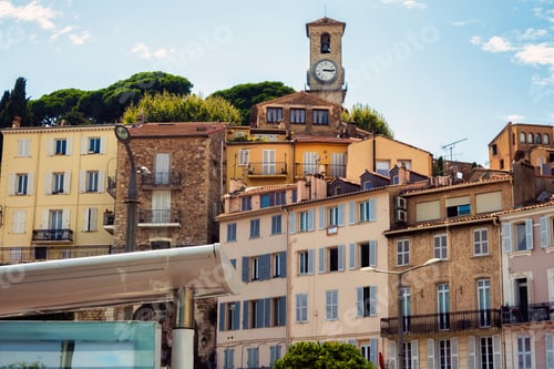 Preview: Buildings and castle tower with clock in Cannes, France
