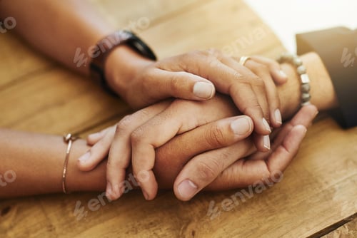 Preview: Closeup shot of two unrecognizable people holding hands in comfort