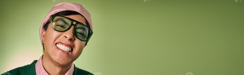 Preview: Stylish asian man showcasing fashion in a vibrant green studio setting