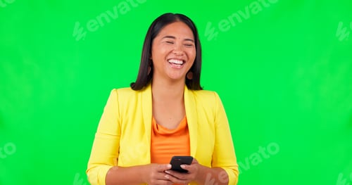 Preview: Green screen, typing and happy woman laughing with phone for joke, silly or funny humor in studio.