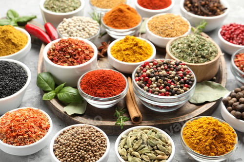 Preview: Different aromatic spices on grey table, closeup