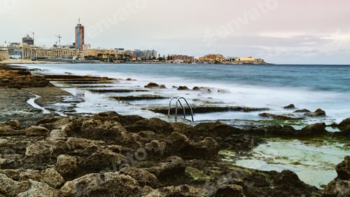 Preview: View to St. Julian's real estate from Sliema coast. Storm at sea, evening time.