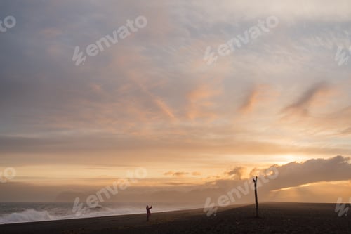 Preview: Young female tourist in Iceland enjoying view of landscapes and travel destinations.